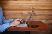 Person typing on laptop computer
