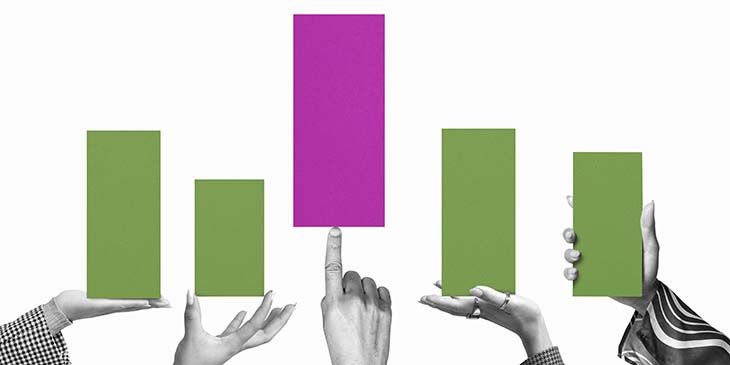 Hands holding up columns of bar graph