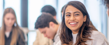 Image of teacher smiling at camera