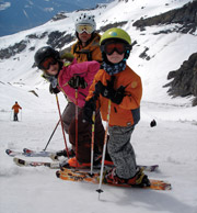Tim and kids skiing - image