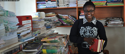 Yvonne from a Kenyan refugee camp with books