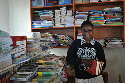Refugee Yvonne with books