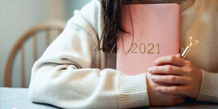 Teacher holding a diary dated 2021