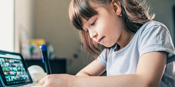 Girl learning at home with iPad