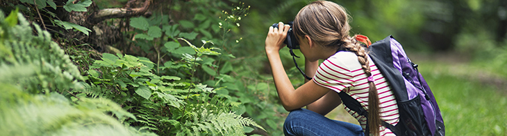 teenager taking photos of wildlife