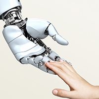 Robot hand reaching out to a human hand
