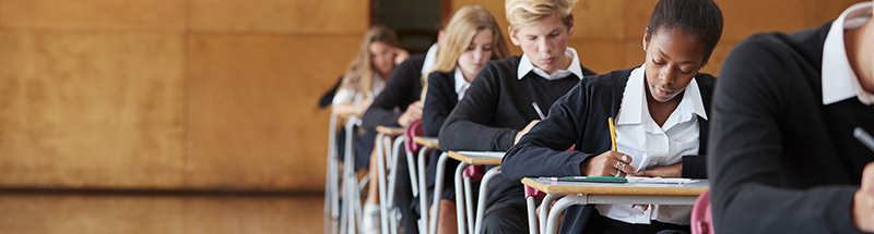 Students sitting exams in an examination hall