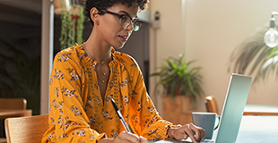 Woman working at a laptop