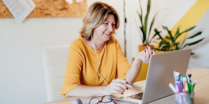 Woman at desk participating in online workshop