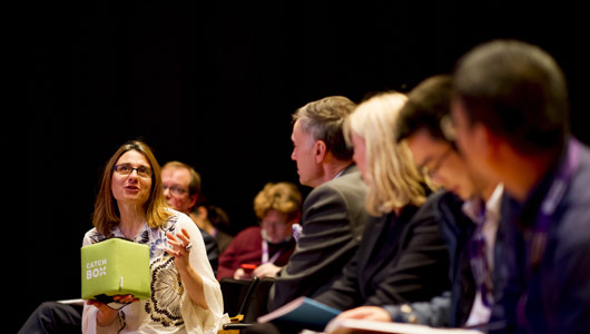 Young girl answering question with her hands