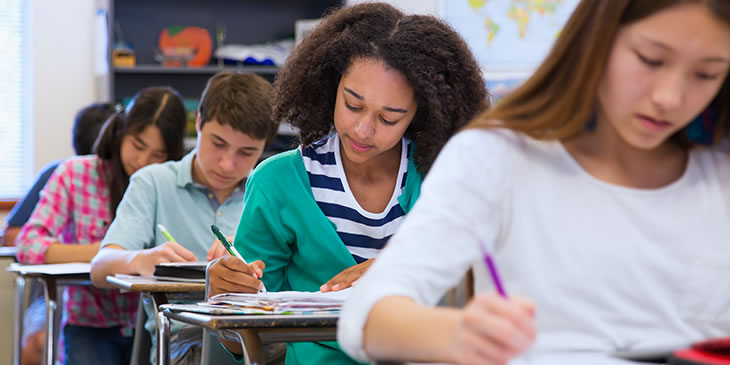 Students taking notes in class