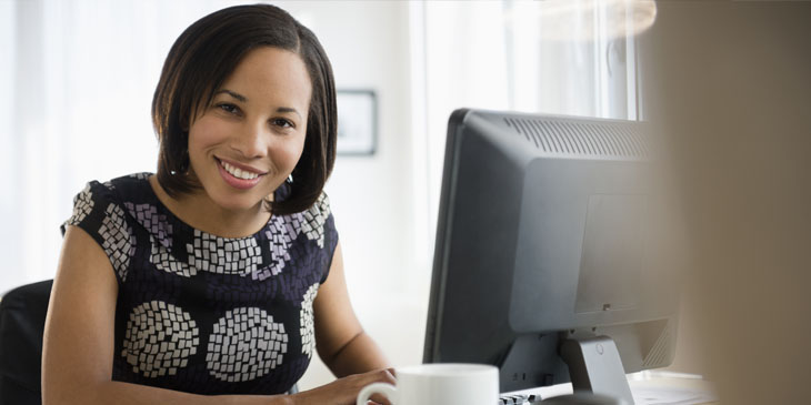 University admissions officer working at a computer