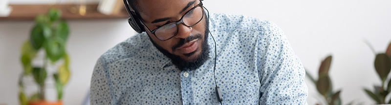 man studying at a computer